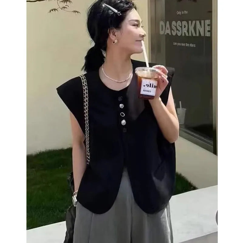 Women's loose fit polyester vest in milky white with pocket detail and 40cm length