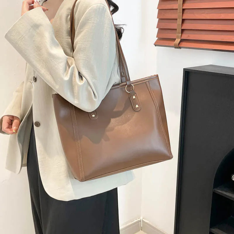 Square black PU underarm shoulder bag with a sandwich pocket design shown from the front.