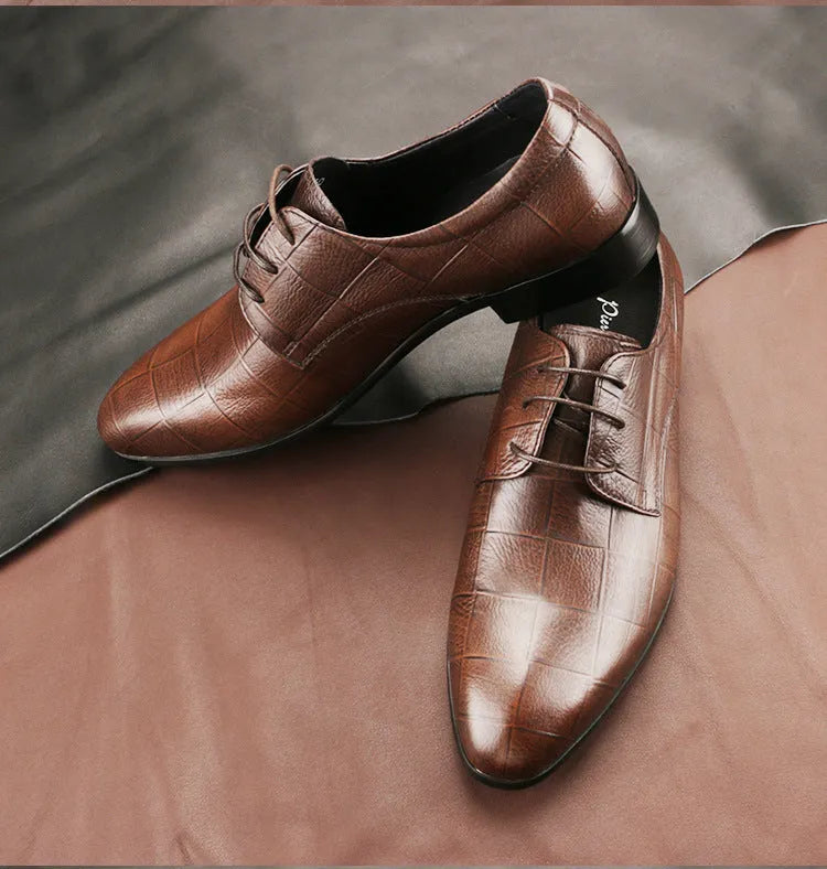 Men's black cow leather Derby shoes with pointed toe and rubber sole on a plain background