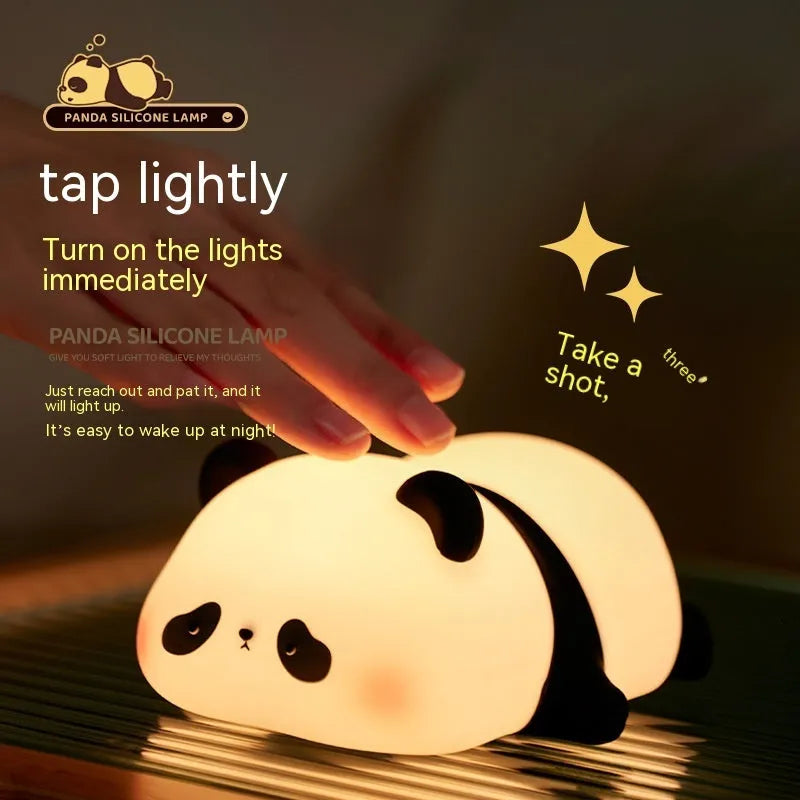 White panda-shaped night light with black accents measuring 150mm tall with USB charging port