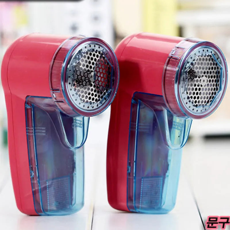 Portable electric lint remover unit showing compact design with collection compartment