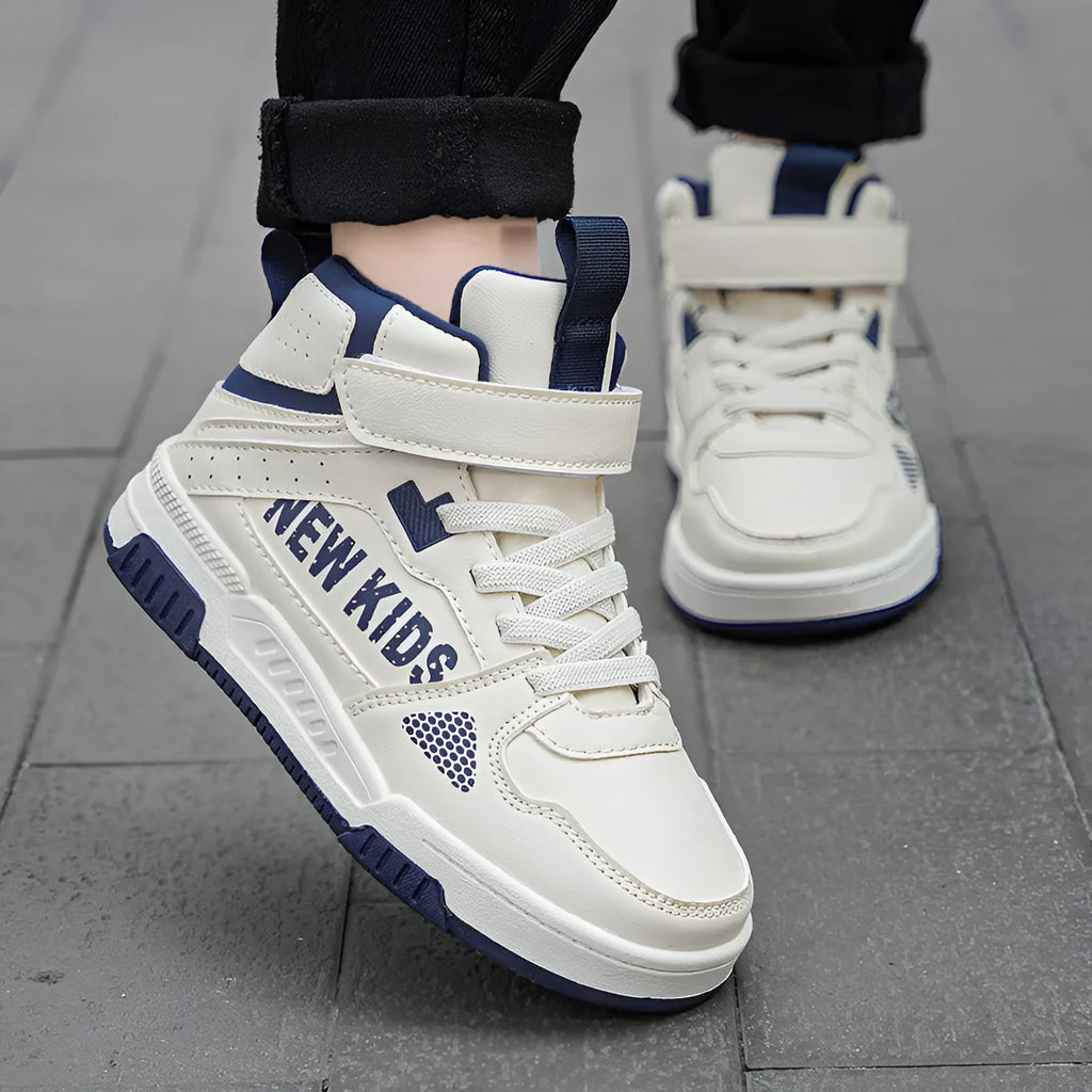 Children's beige green street sneakers with a buckle closure, shown on a white background.