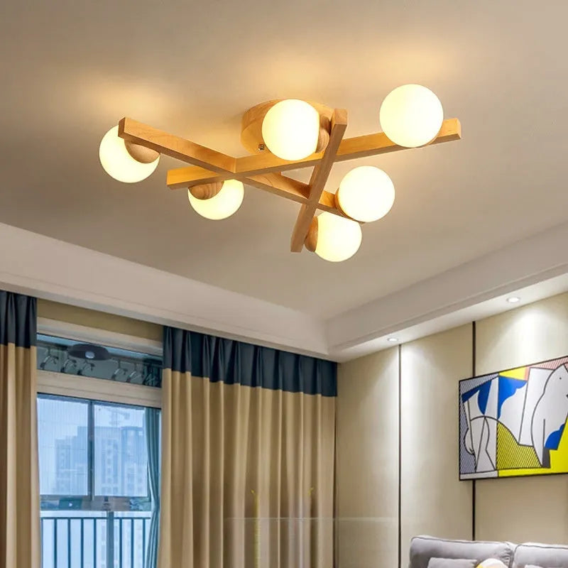 Wooden style modern ceiling light with three neutral light heads in Nordic design