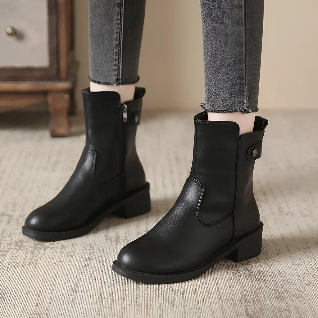 Black women's low heel ankle boots with a side zipper and round toe.