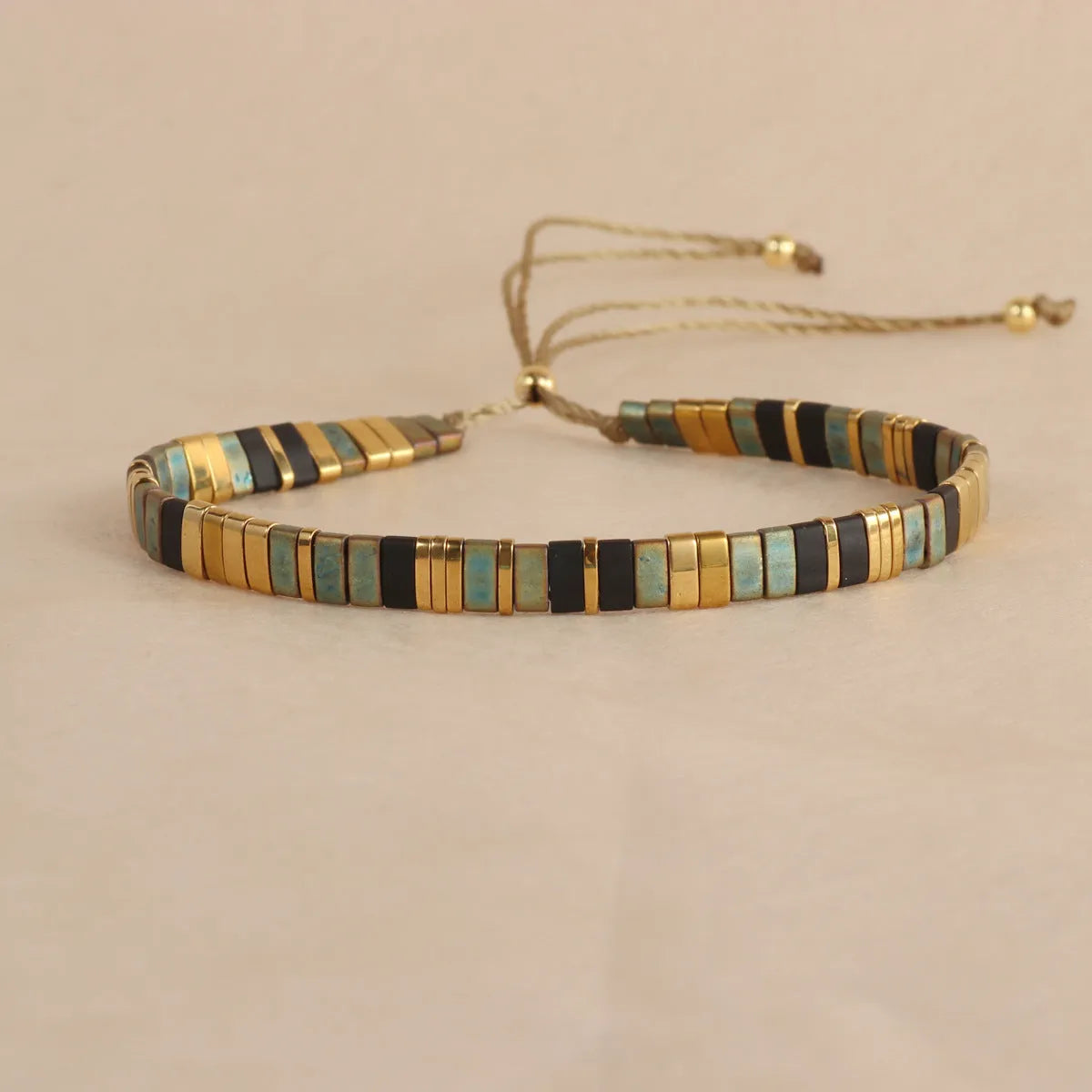 Geometric glass and coloured glaze bead bracelet in milky white, black, green, blue, or red