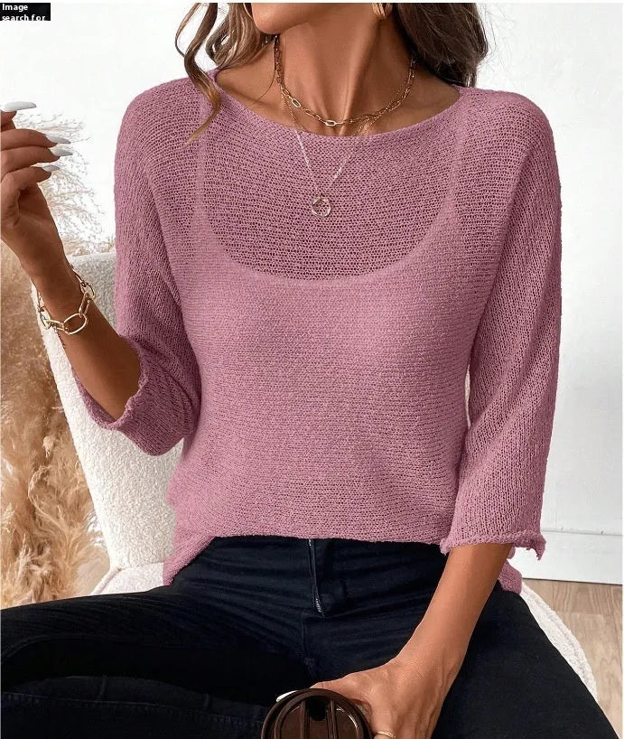 Women's off-shoulder knitted pullover top in lavender purple with a 3D pattern and 3/4 length sleeves.