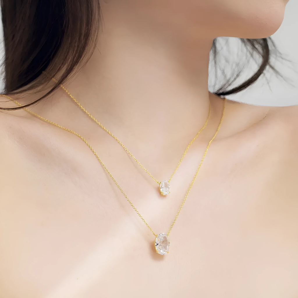 S925 sterling silver necklace with a geometric oval ice flower pendant in a choice of platinum or gold finish.