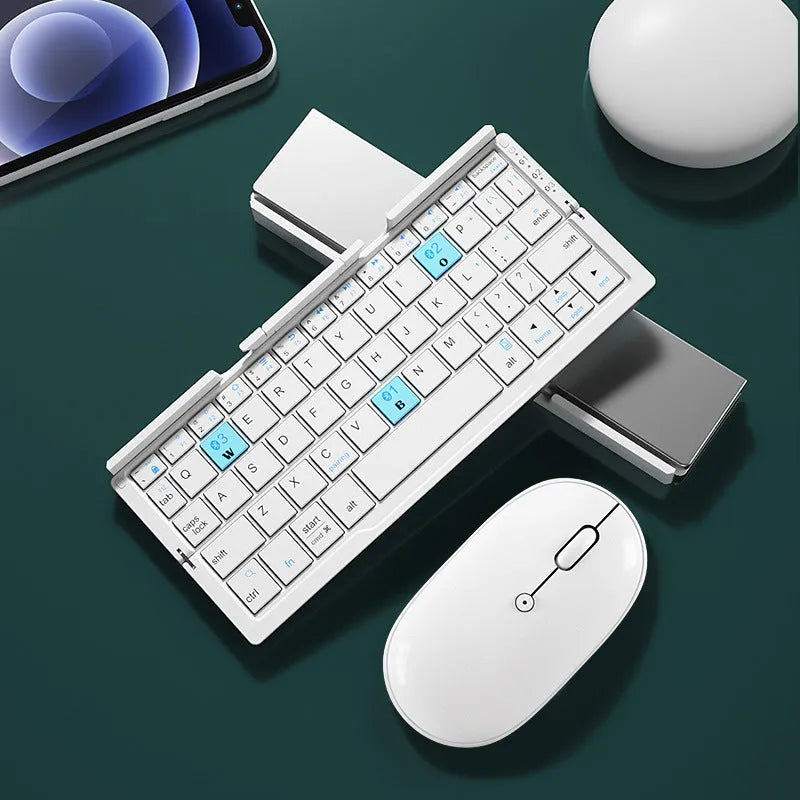 Silver white folding Bluetooth keyboard with hidden stand supporting smartphone, shown open and closed