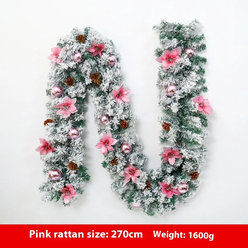 PVC Christmas rattan garland with flocking in golden colour, draped decoratively.