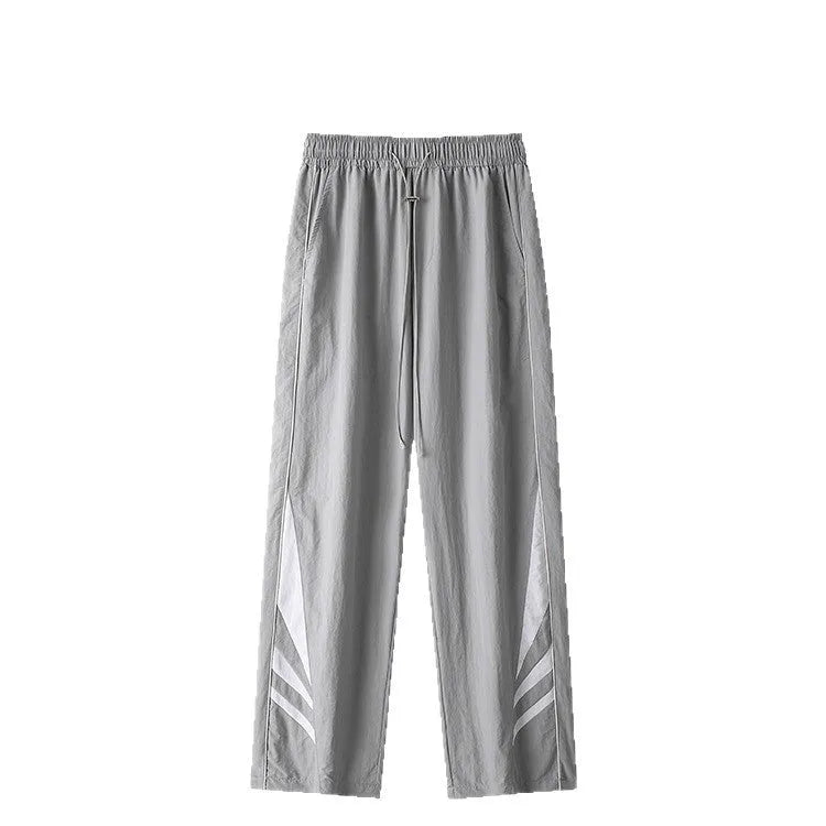 Men's straight-leg sports trousers in black with elastic waistband and button front