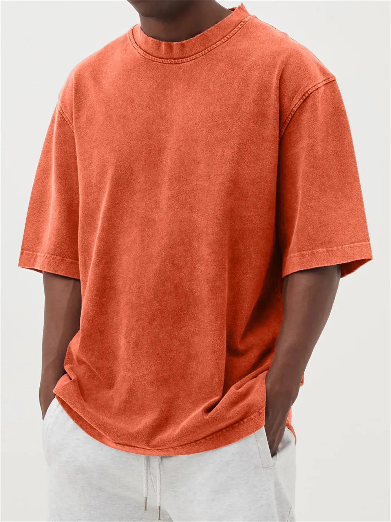 Men's washed distressed pullover t-shirt in solid colour with loose fit and stone washed finish