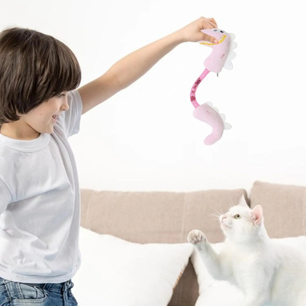 Set of four cat toys: plush fish, mouse, bunny, and a catnip rope on a pink background.