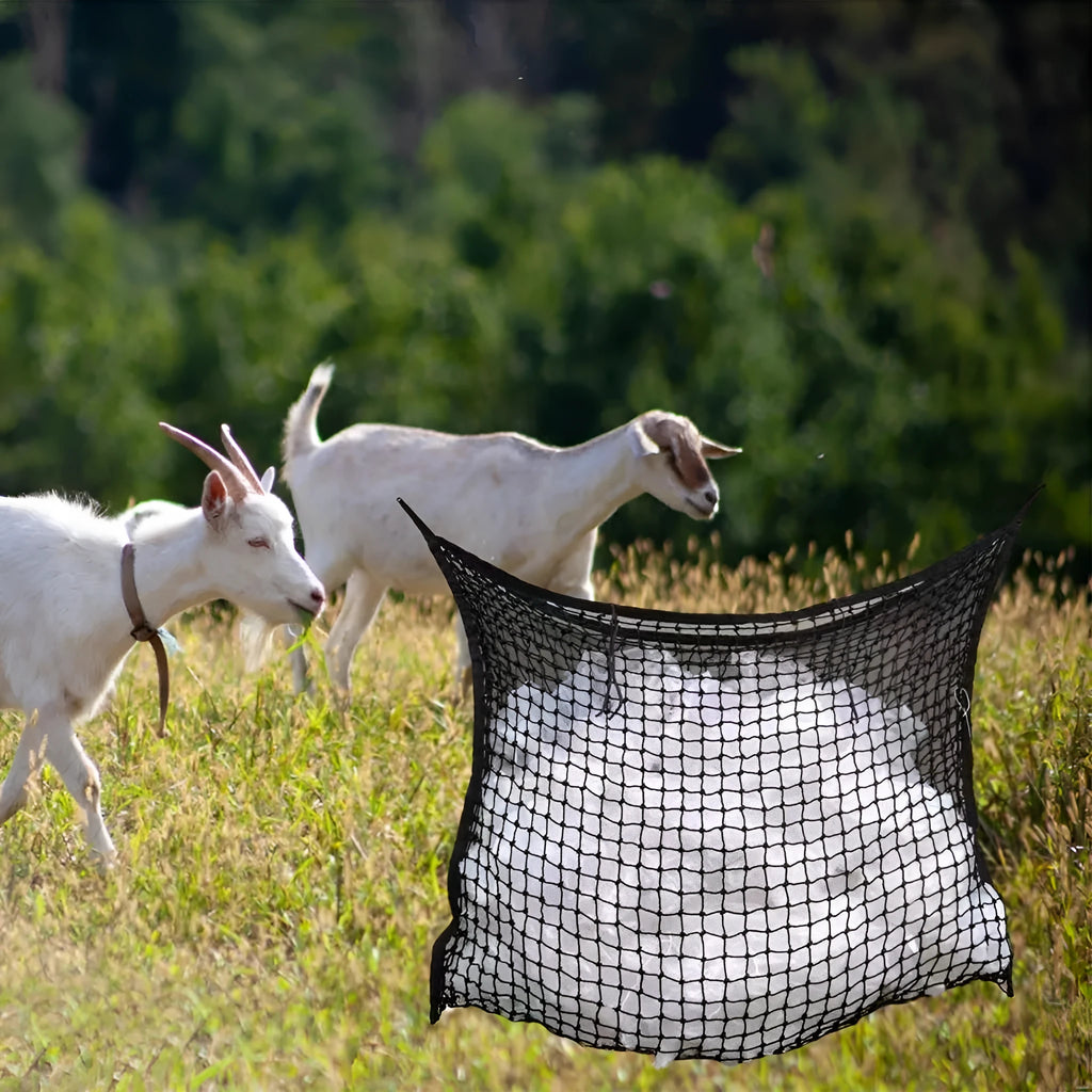 Woven PE rope mesh horse feeding bag hanging with hay inside, black colour shown
