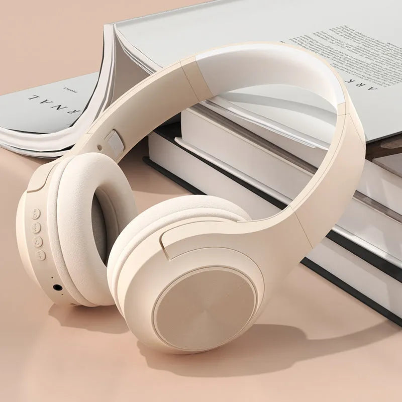 Creative design wireless Bluetooth headset in ivory white, shown in a head-mounted wearing style.