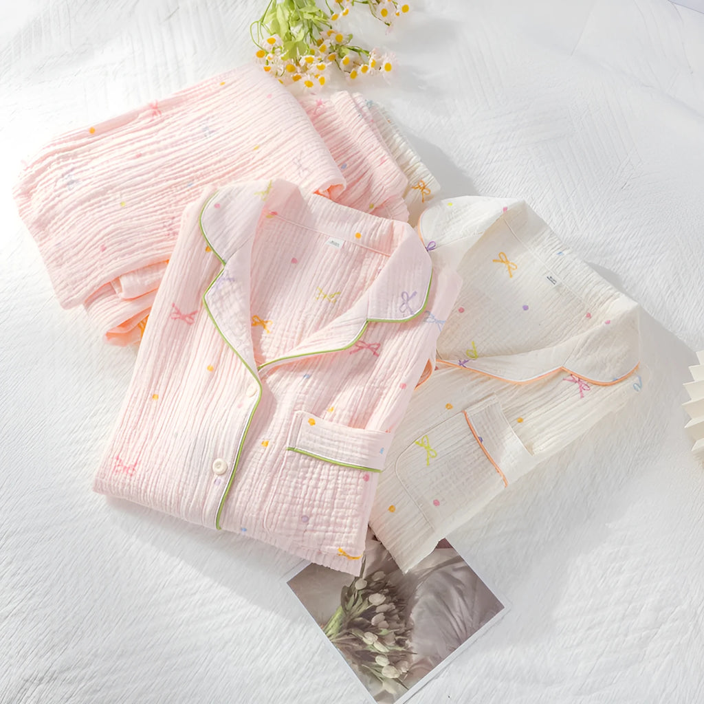 Women's beige cotton pajama suit with long sleeves and trousers for homewear.