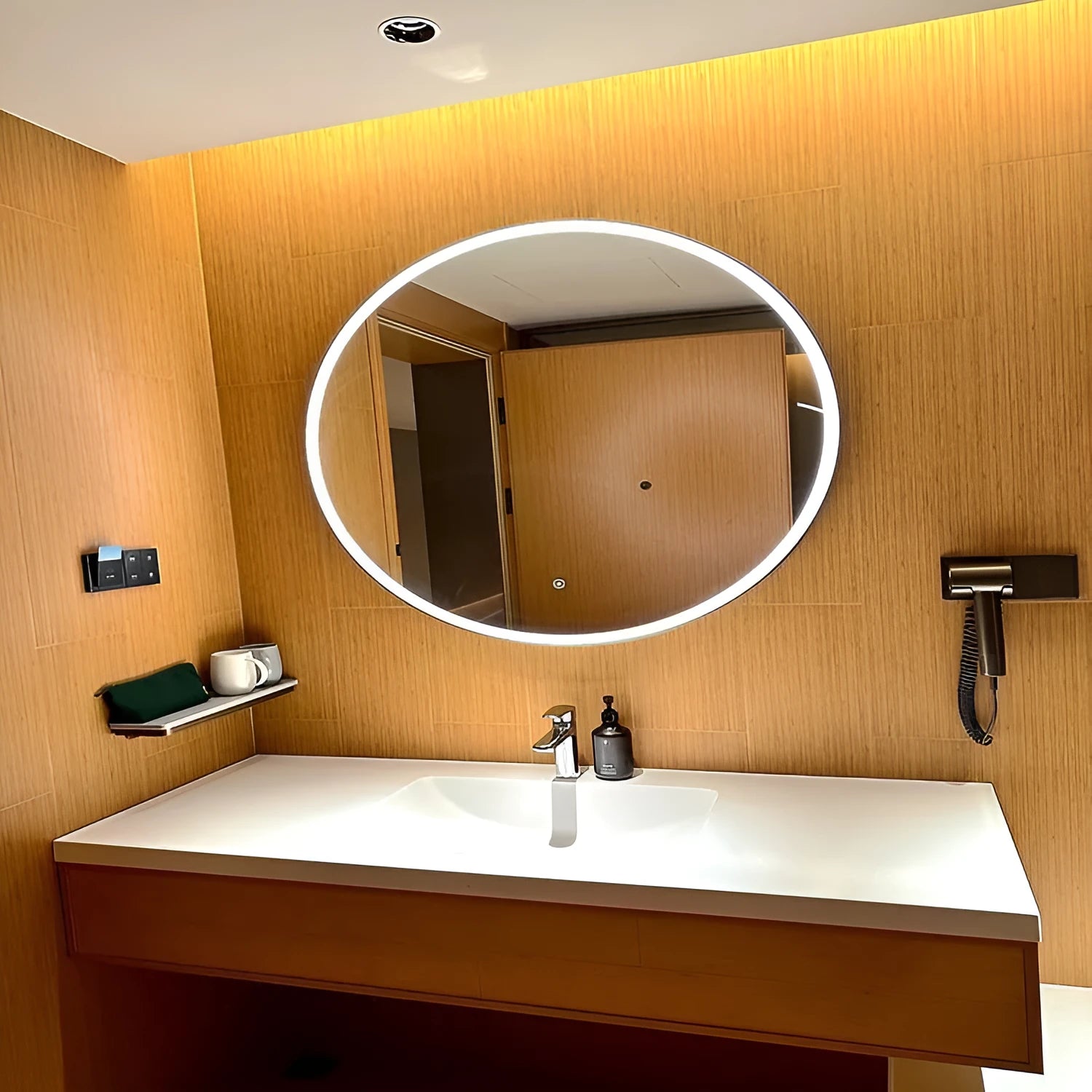Black frame round smart LED bathroom mirror with touch control mounted on wall