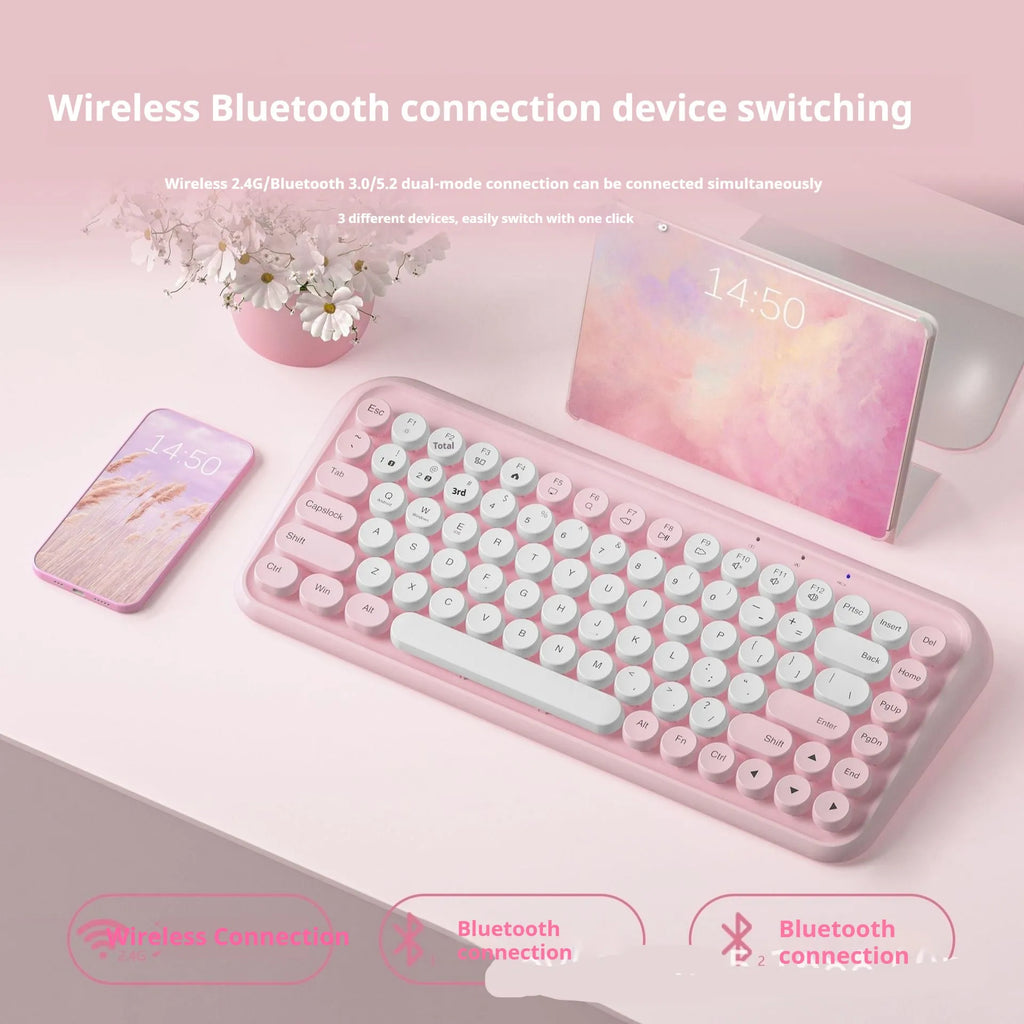 Pink dual-mode wireless Bluetooth mute portable keyboard with 84 keys and ABS construction on a desk