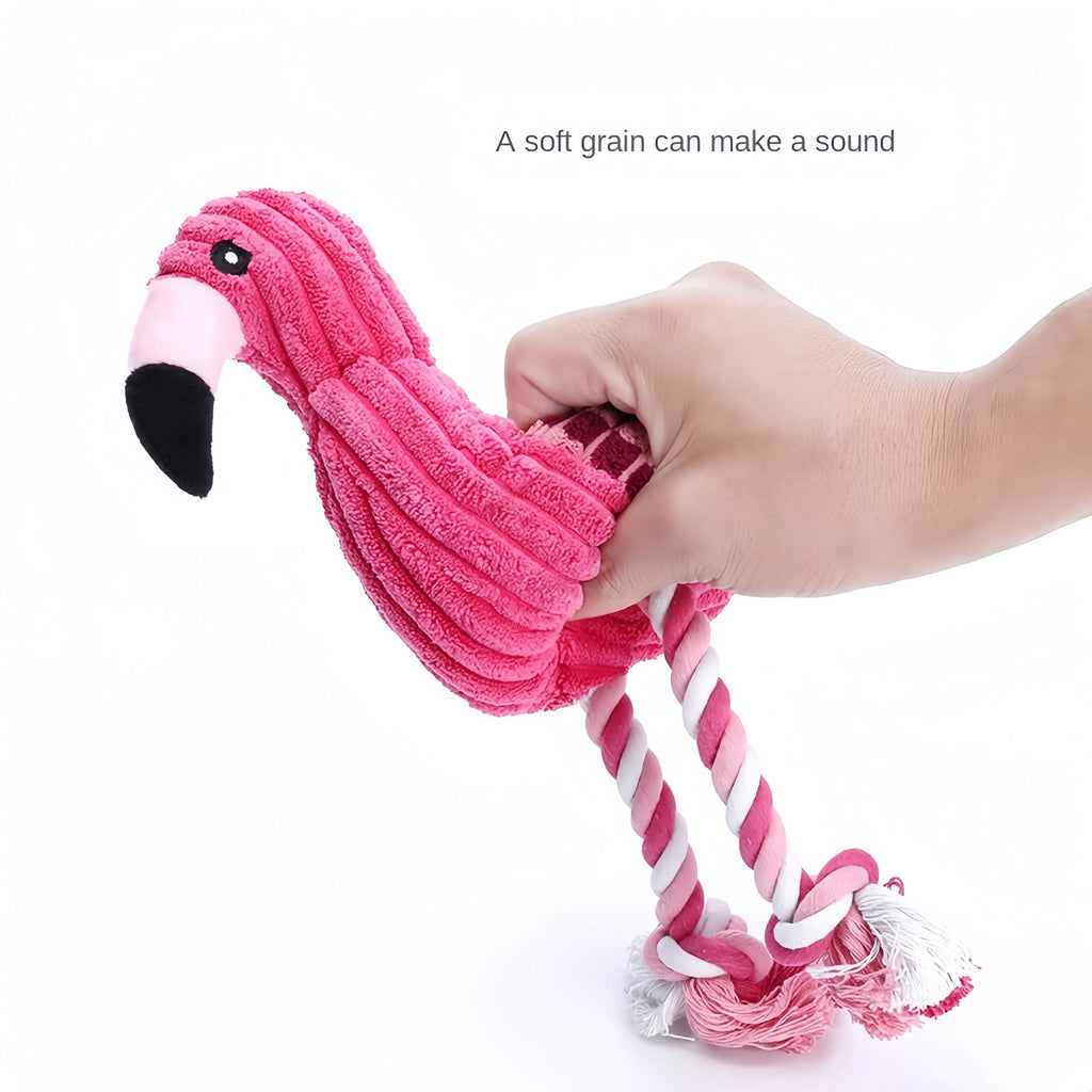 Pink corduroy hippo and parrot squeaky plush dog toys on a white background.