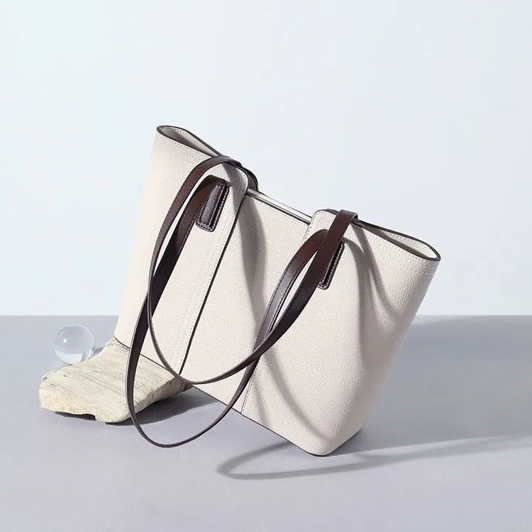 Genuine leather women's large shoulder bag in box-type design with sandwich pocket.