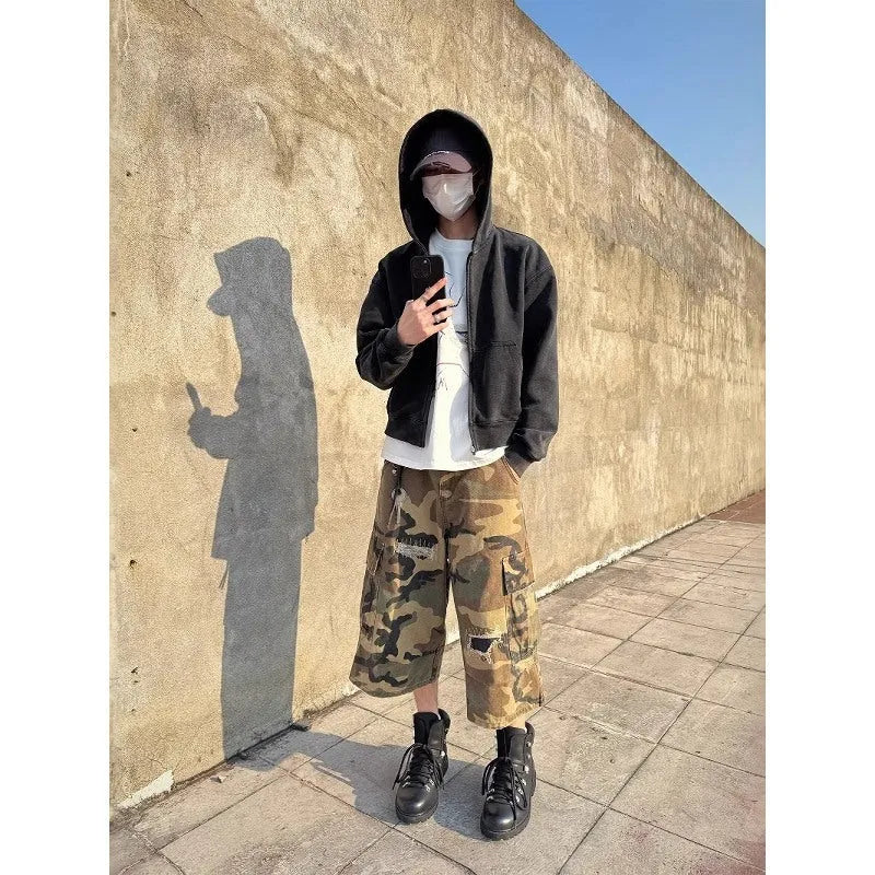 Men's camouflage cropped jeans with retro patches and ripped detailing in straight leg cut