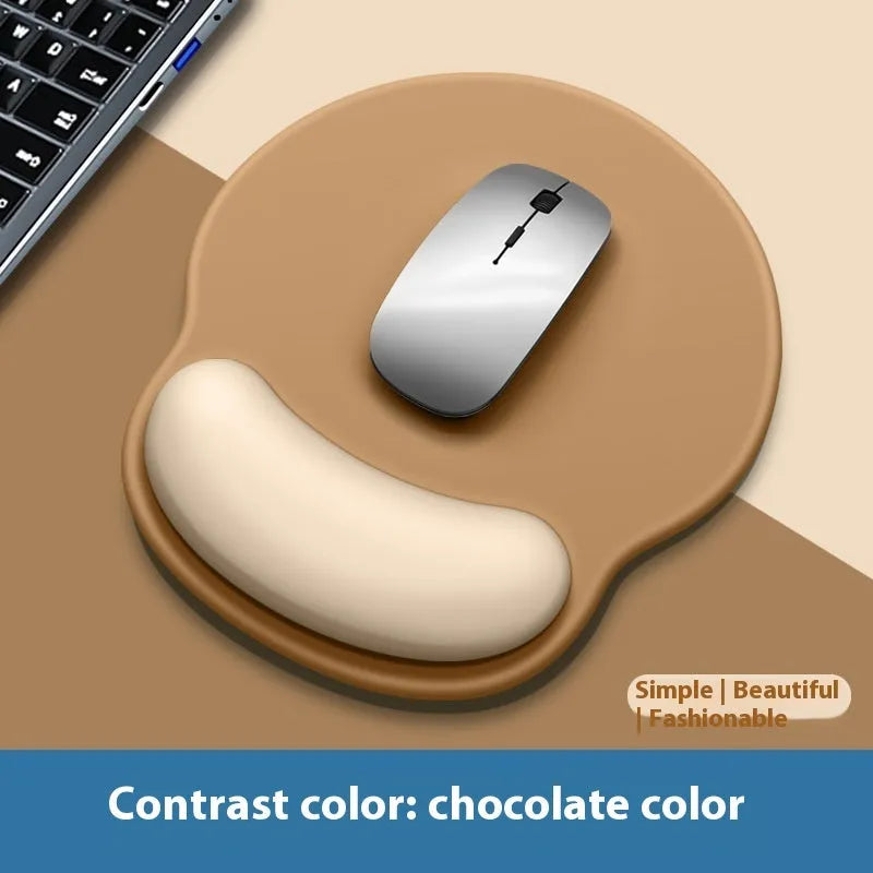 Silicone mouse mat with wrist rest in gradient colour pattern on desk