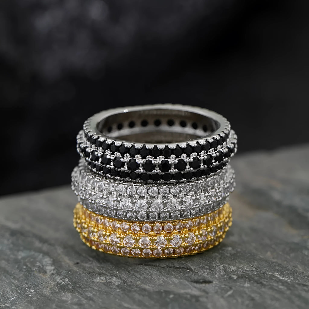 Geometric triangle design engagement ring with zircon stone inlay, shown in different metal plating finishes.