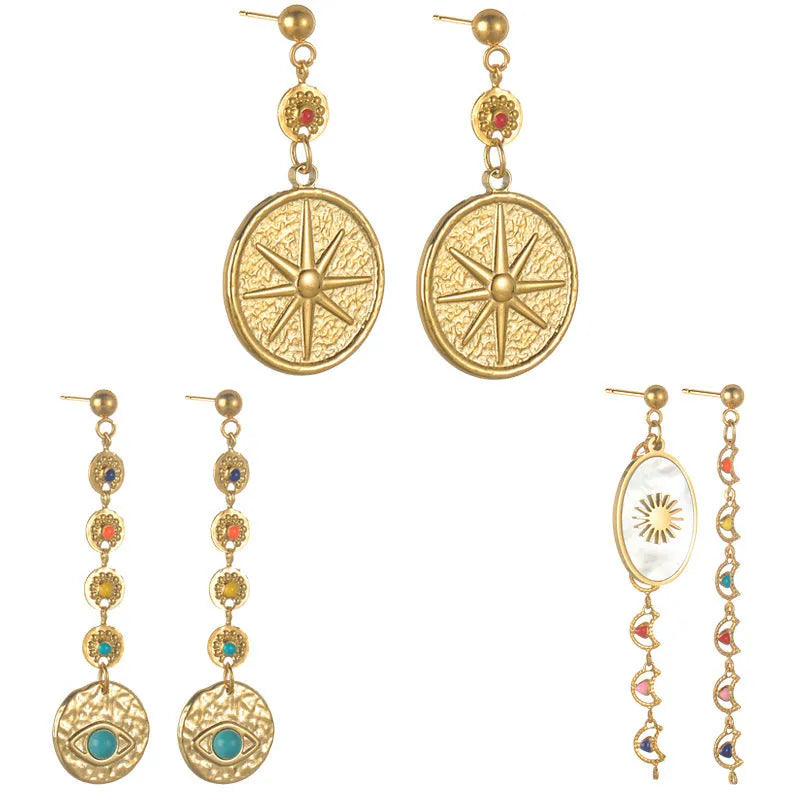 Geometric stainless steel drop earrings showing star, eye and shell sun designs for pierced ears