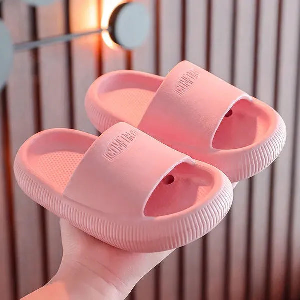Children's brightly coloured EVA slippers with a thick, non-slip sole.