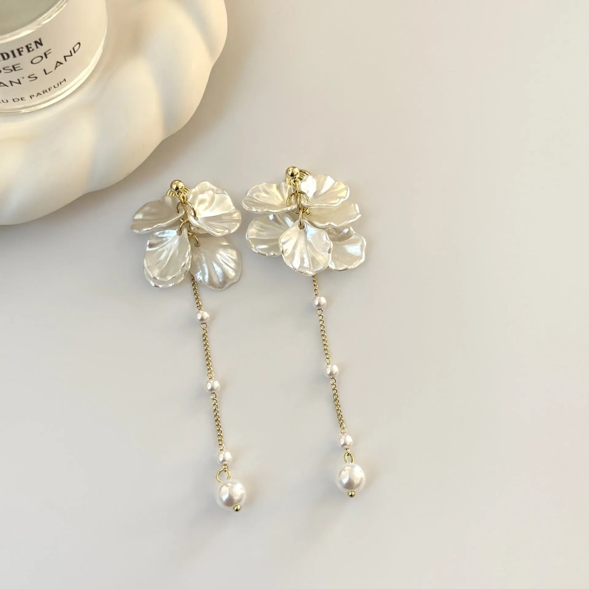 Women's shell pearl tassel earrings with four clip options measuring 8.8cm length