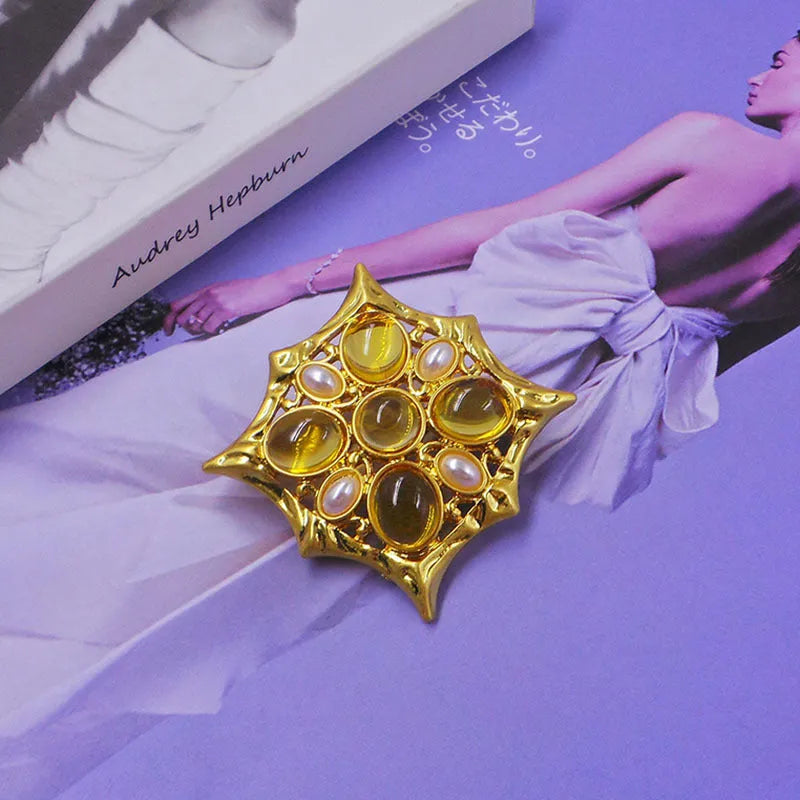 Close-up of a vintage zinc alloy baroque cross brooch with crystals, showing one of eight available colour styles.