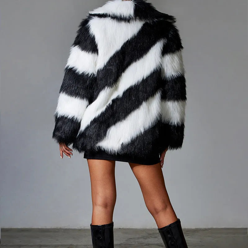 Minimalist women's faux fur coat with contrast colour lapel and a detachable fur collar.