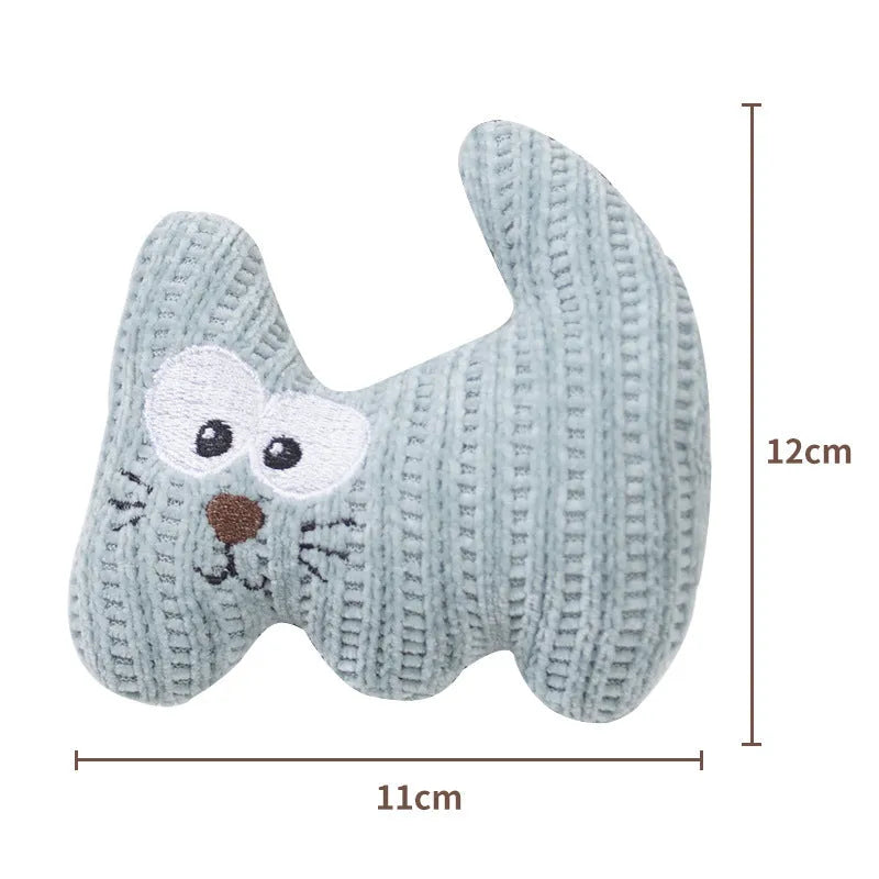 Cyan and light coffee coloured plush catnip toy with a bell, shown next to a measuring tape indicating 12cm length.