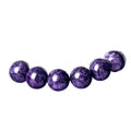 Natural transparent charoite crystal bracelet with platinum settings on wrist.