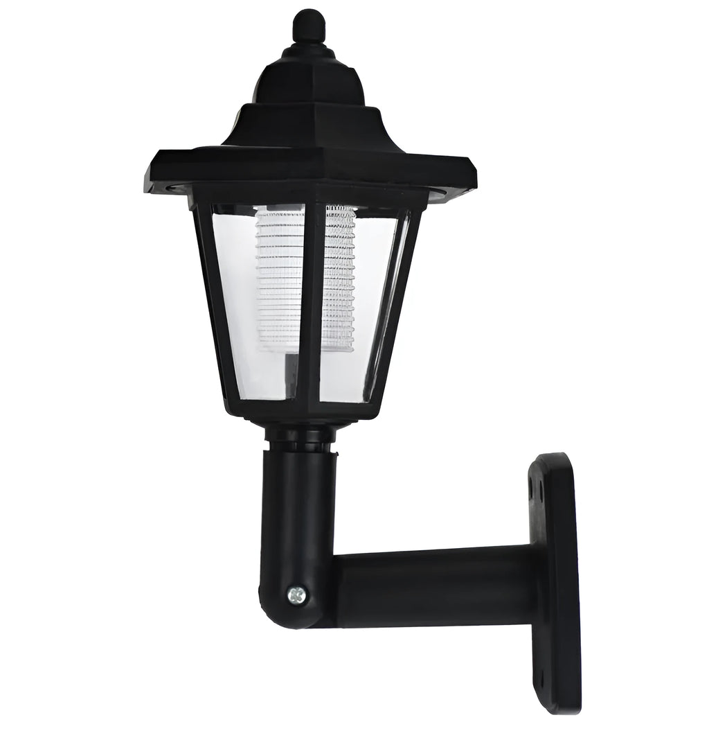 Black hexagonal solar wall lamp with light sensor mounted on an outdoor wall