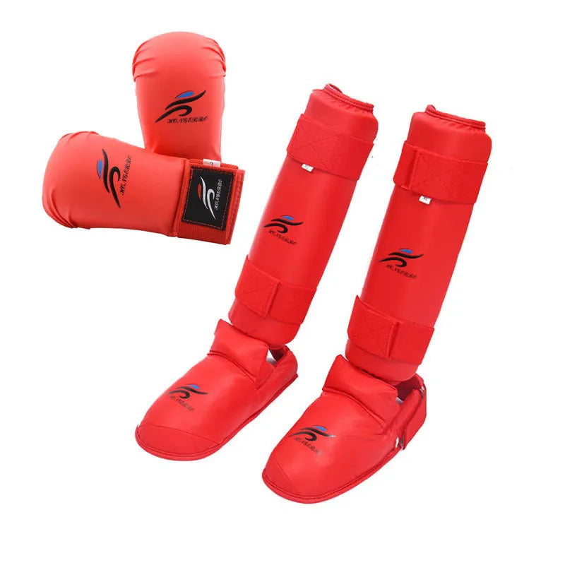 Red martial arts protective gear set showing leg guard, helmet, and boxing gloves for karate taekwondo training