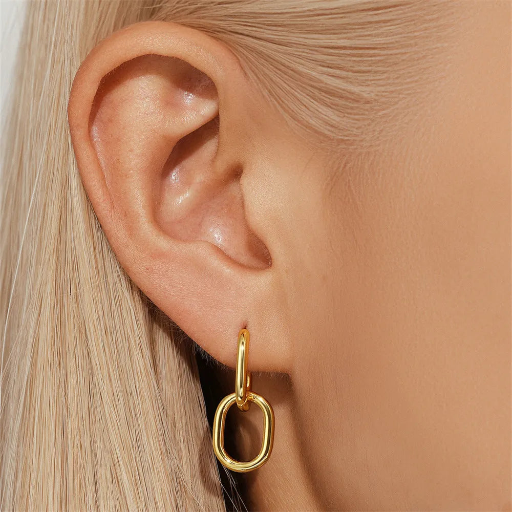 Golden electroplated brass earclip earrings with geometric round design