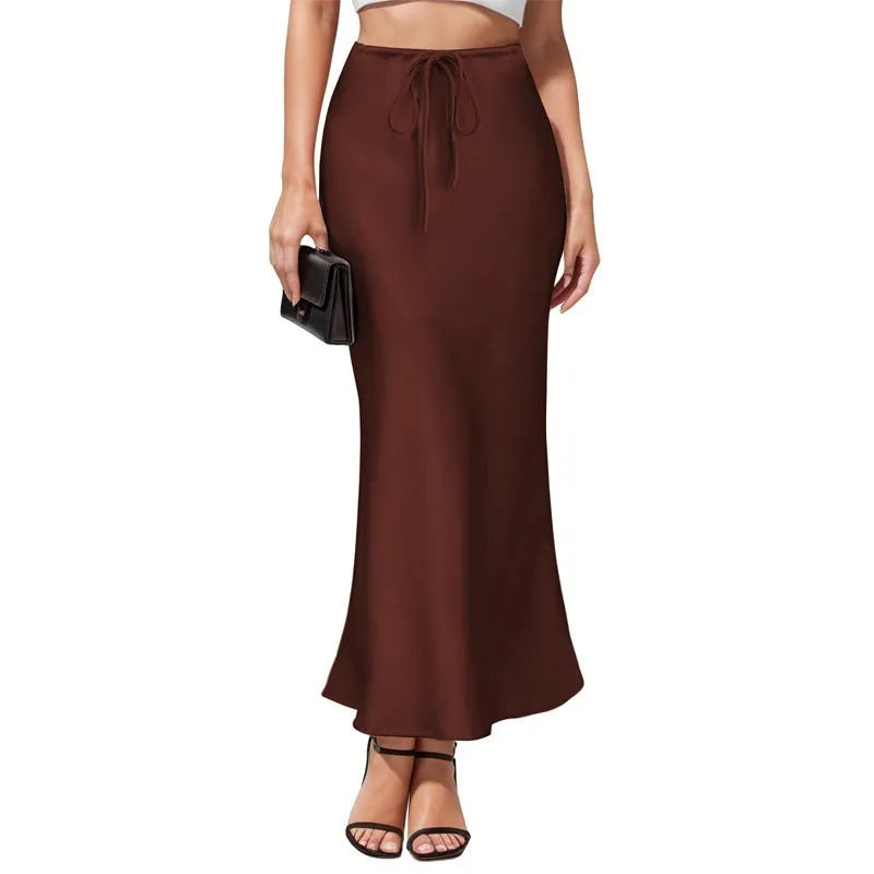 Asymmetric acetate satin skirt in milky white showing high waist design and irregular stitching detail