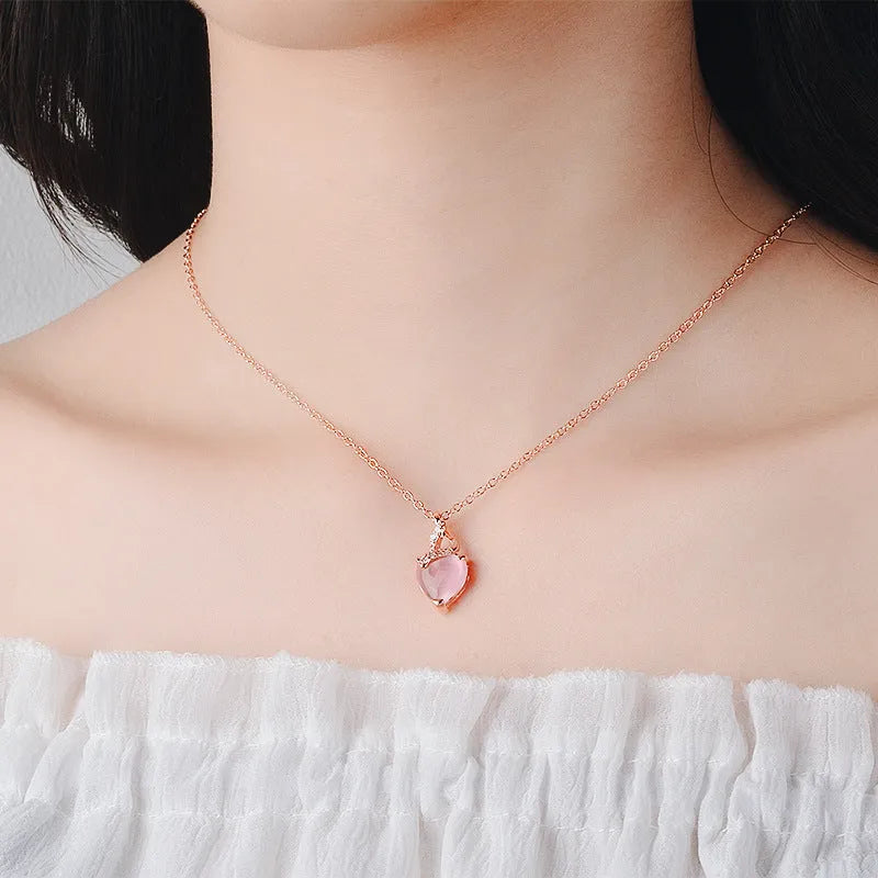 Women's heart-shaped artificial crystal pendant on rose gold electroplated cross chain necklace