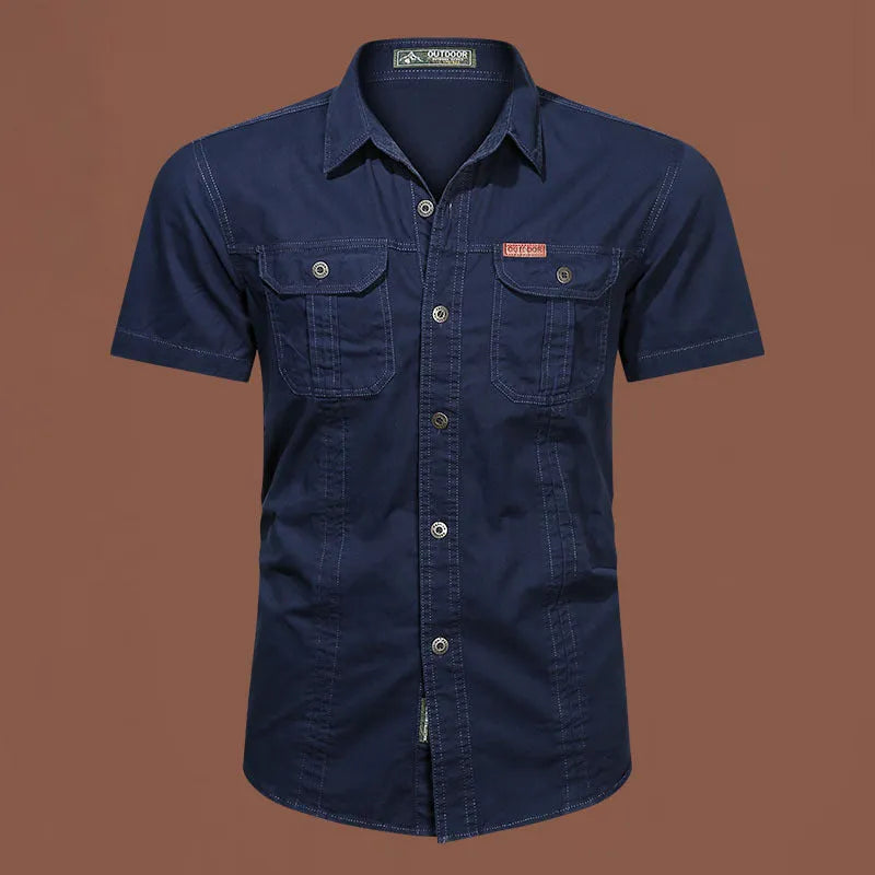 Men's loose-fitting short sleeve cotton work shirt in army green, laid flat.