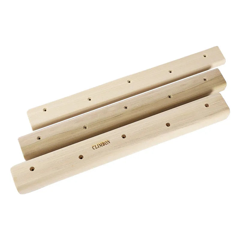 Set of three solid wood grip strength training hangboards in varying thicknesses.