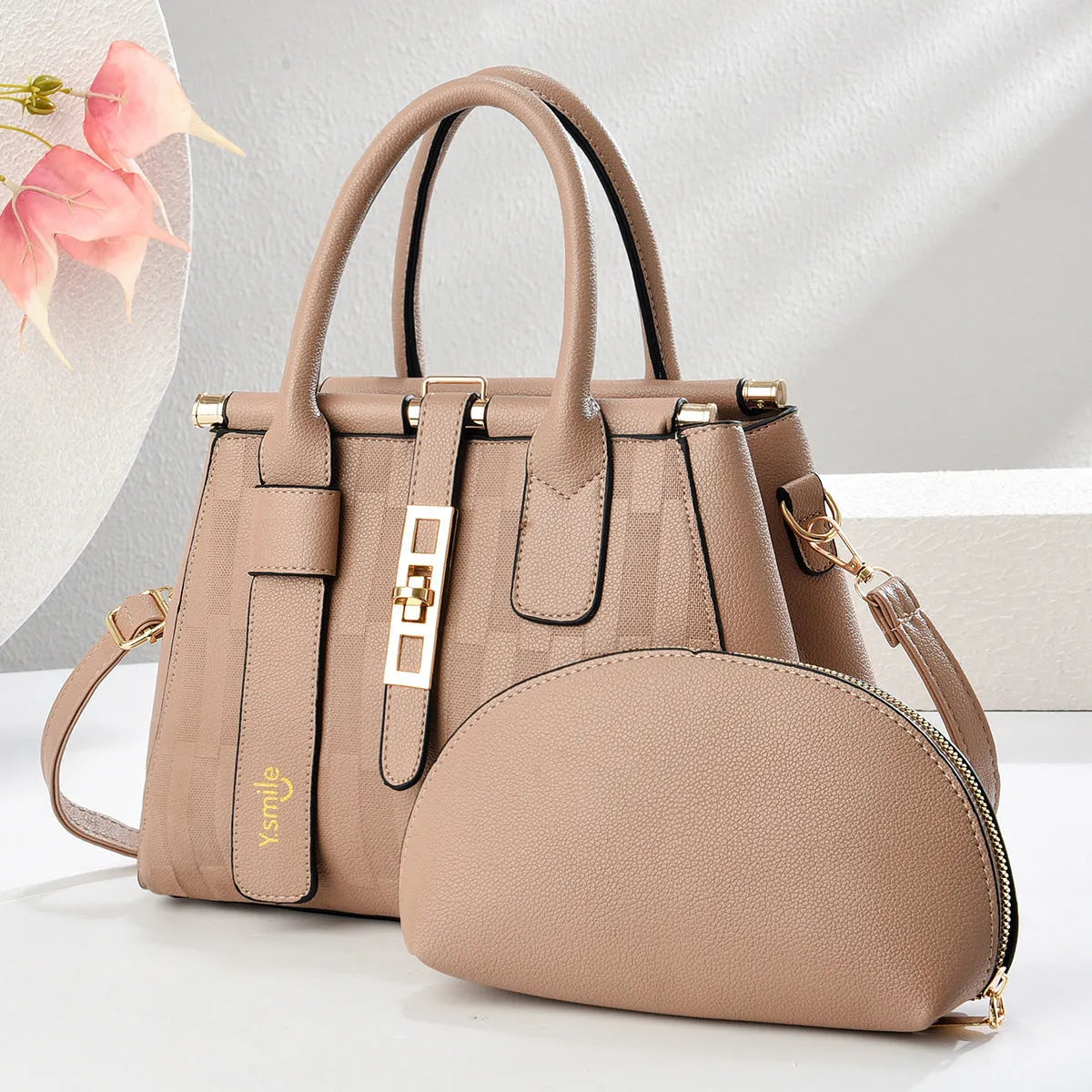 Round black PU leather crossbody bag with adjustable strap on a mannequin, showing zip closure.