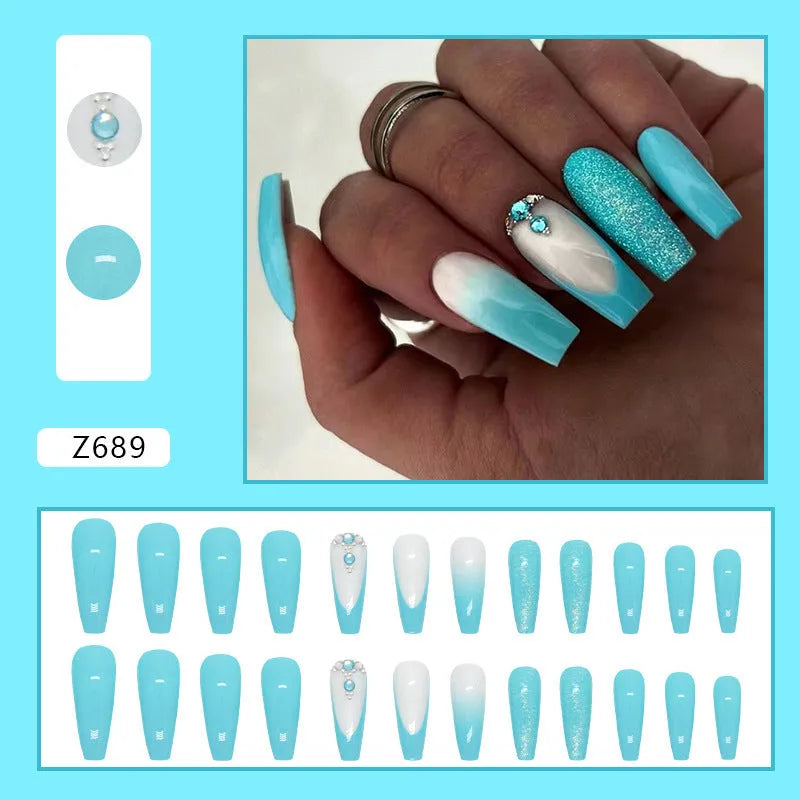 Smart blue diamond press-on nails with long ballet shape and debris pattern
