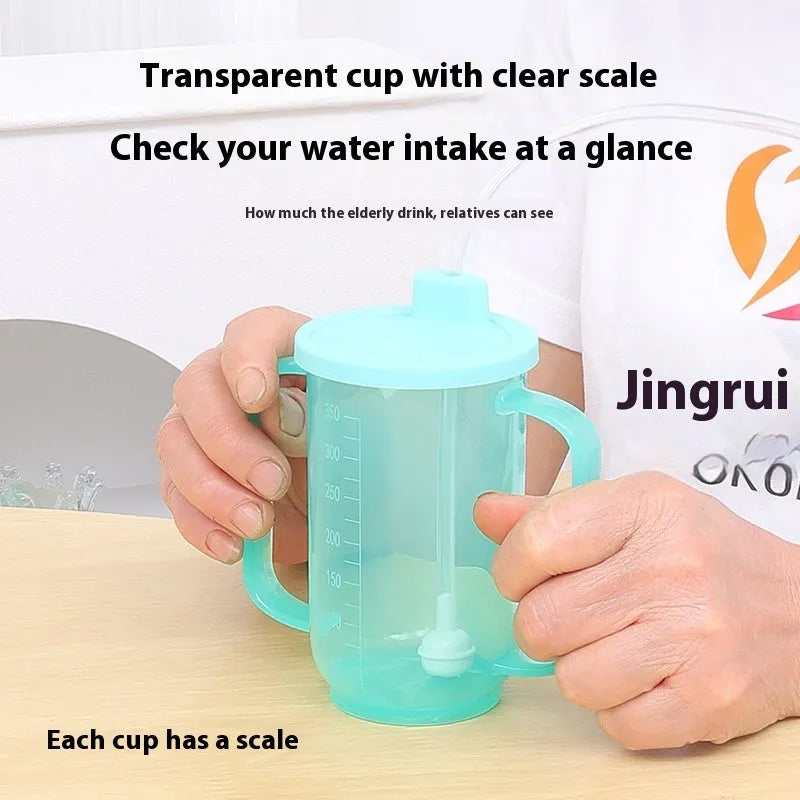 Adult bedside drinking cup with angled choke-proof mouth, handle, and lid, shown in care setting.