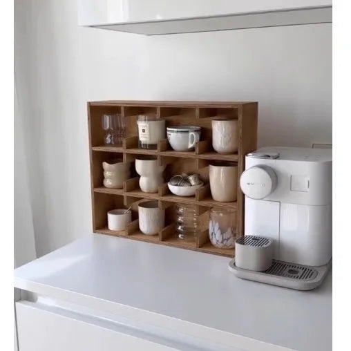 Square solid wood cup storage rack with birch finish and multiple square compartments for organising mugs.