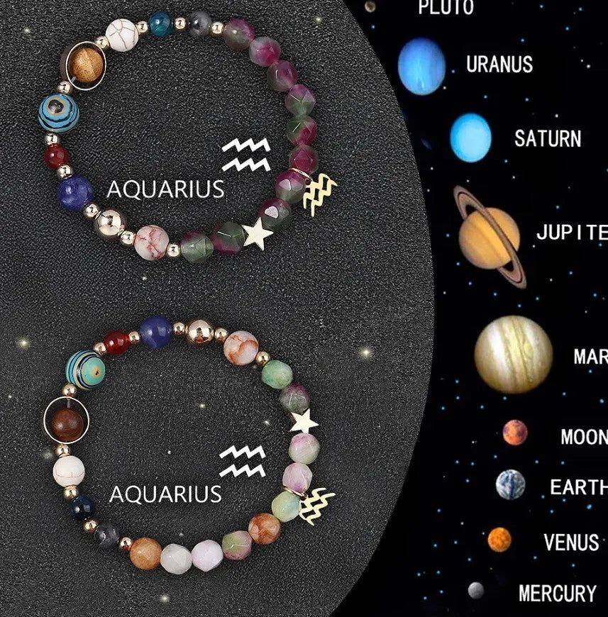 Set of two natural stone beaded bracelets on a wrist, each representing a different zodiac sign style.