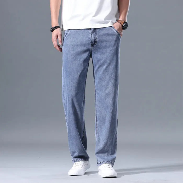 Men's loose fit straight-leg lyocell jeans in light blue colour with a zip fly.