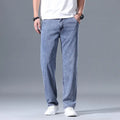 Men's loose fit straight-leg lyocell jeans in light blue colour with a zip fly.