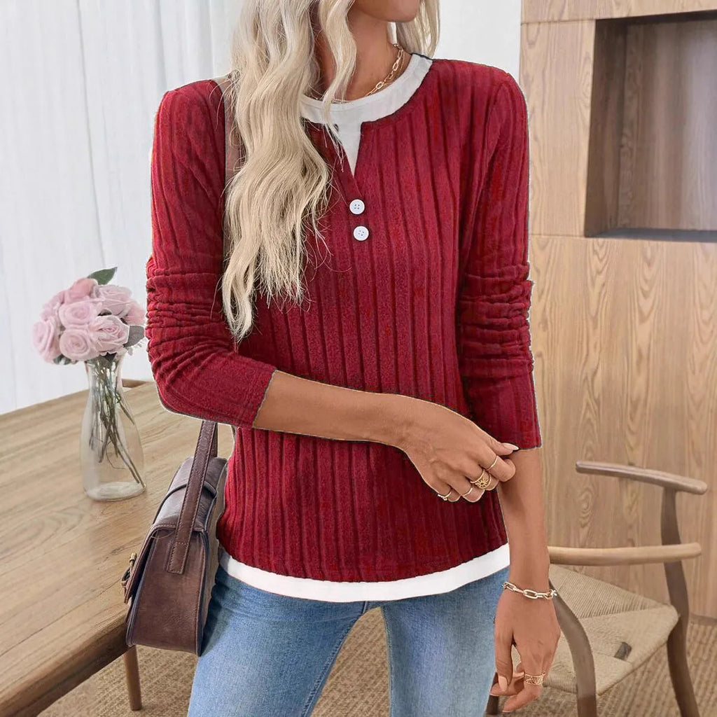 Women's black fake two-piece pullover sweater with round neck and long sleeves.