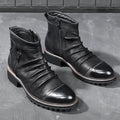 Black side zip Martin boots with round toe and medium heel on a plain background.