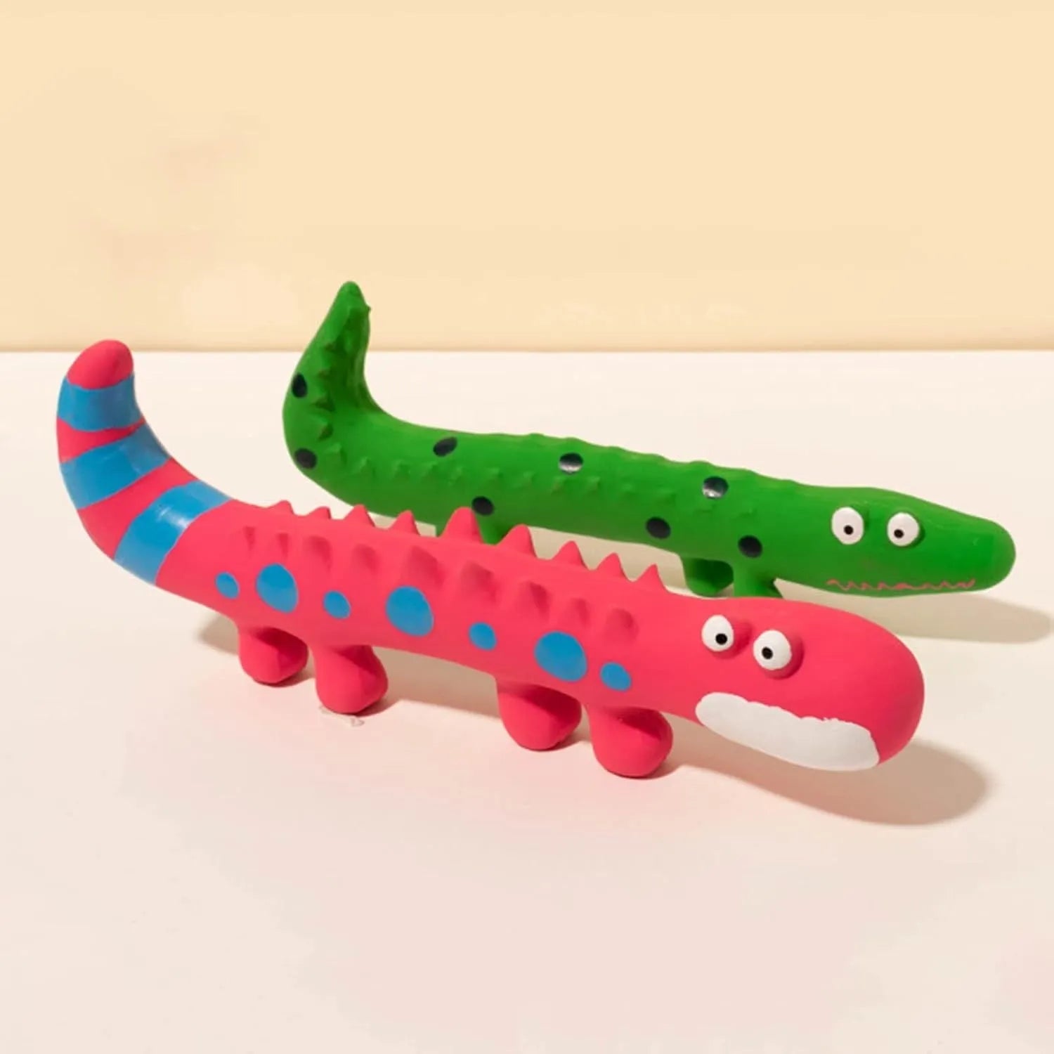 Green lizard-shaped squeaky dog chew toy with cartoon design for aggressive chewers